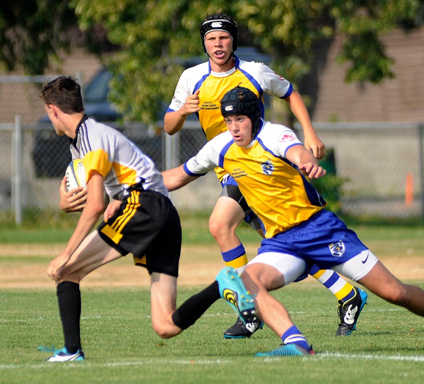 Alan Woodhouse from Penticton, right, of the BC U15s set to make the tackle on the first day of play.