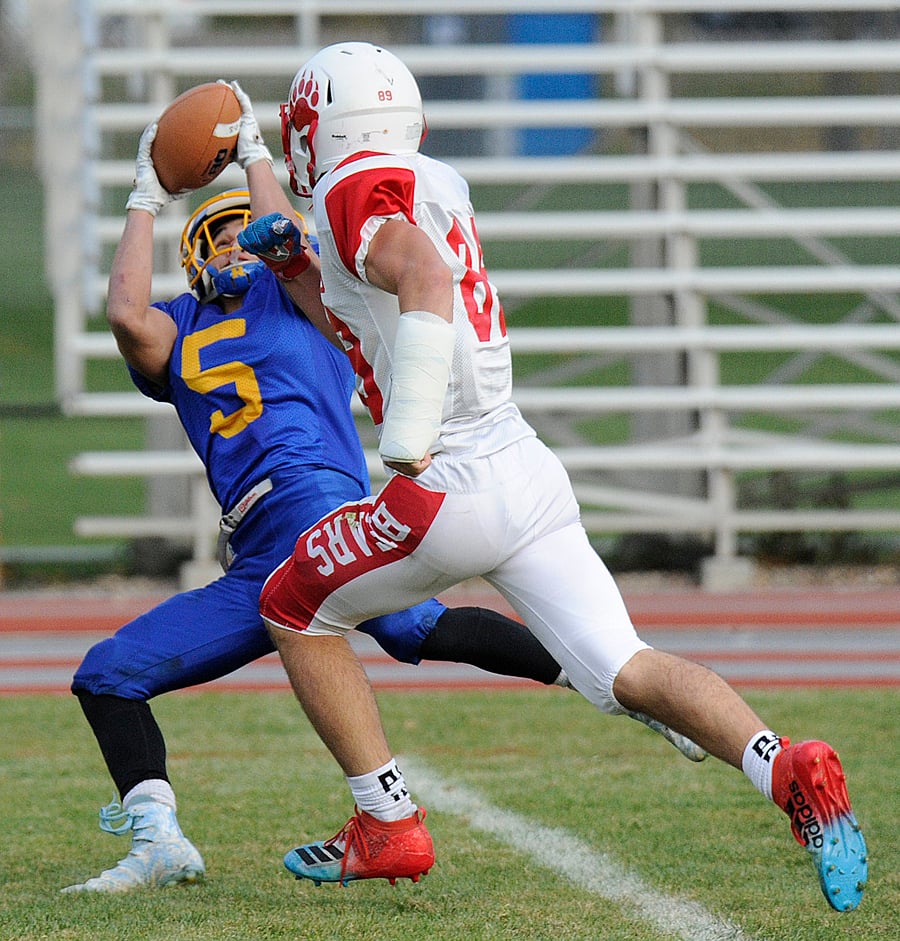 Ryan Dovedoff of the Rutland Voodoos makes one of his three catches in a 47-0 win over the Mt. Boucherie Bears at the Apple Bowl in the final game of the regular season.
