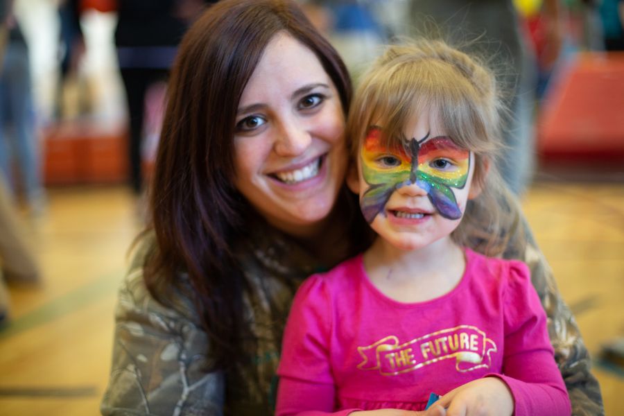 <who>Photo credit: NowMedia</who> Clarke and her daughter Abigail showing off her sparkly face paint