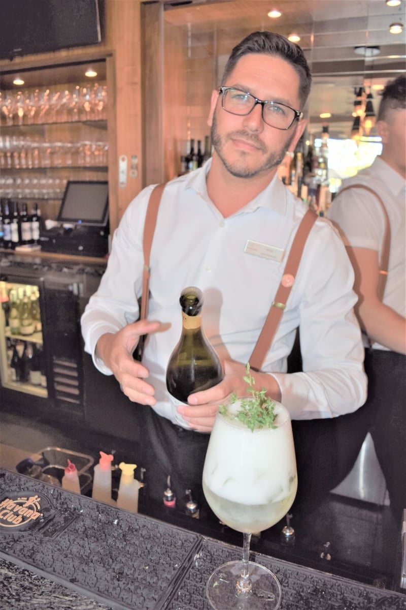 </who>Lead bartender Kyle Yrjola mixes up Maestro's signature cocktail -- the Stone Fruit Smash.