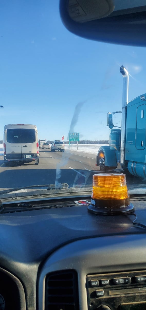 </who>Trucker Sean Tiessen from Grand Forks provided this photo taken out the front window of his truck yesterday outside of Winnipeg.