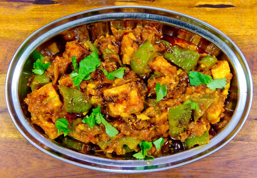 Chili Paneer (bell pepper and paneer cooked with onions and Indian spices).