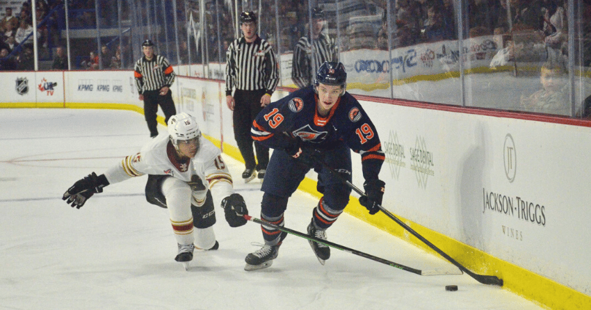 Caedan Bankier, who scored the Blazers sixth goal, battles with right winger Jaden Lipinski.