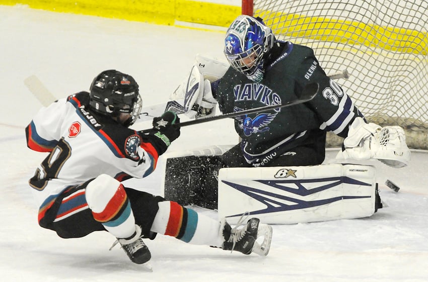 <who>Photo Credit: Lorne White/KelownaNow </who>Ryder Ritchie scores while falling to the ice in the Kelowna Rockets' opening-game matchup against Calgary. 