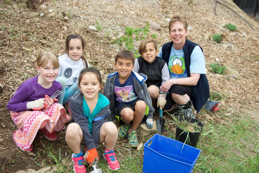 <who>Photo Credit: KelownaNow</who> Mrs. Foster and some of her students