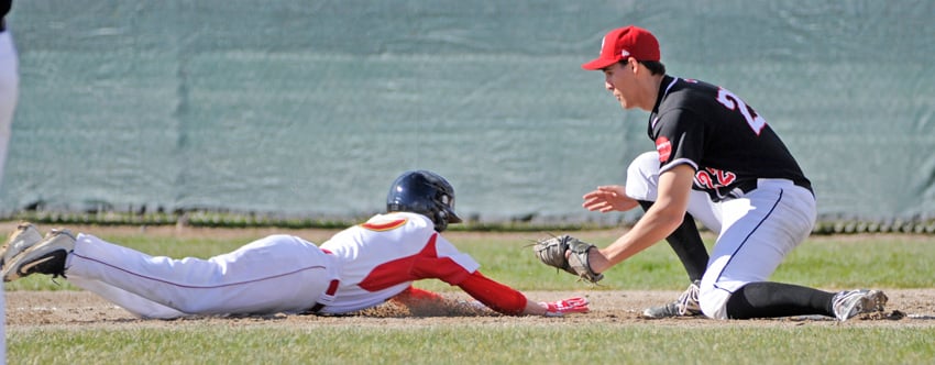 <who>Photo Credit: Lorne White/KelownaNow </who>First baseman Marcus Glowacki combined with OC pitcher Zach Yandeau to pick off a Dinos runner in Game 2.