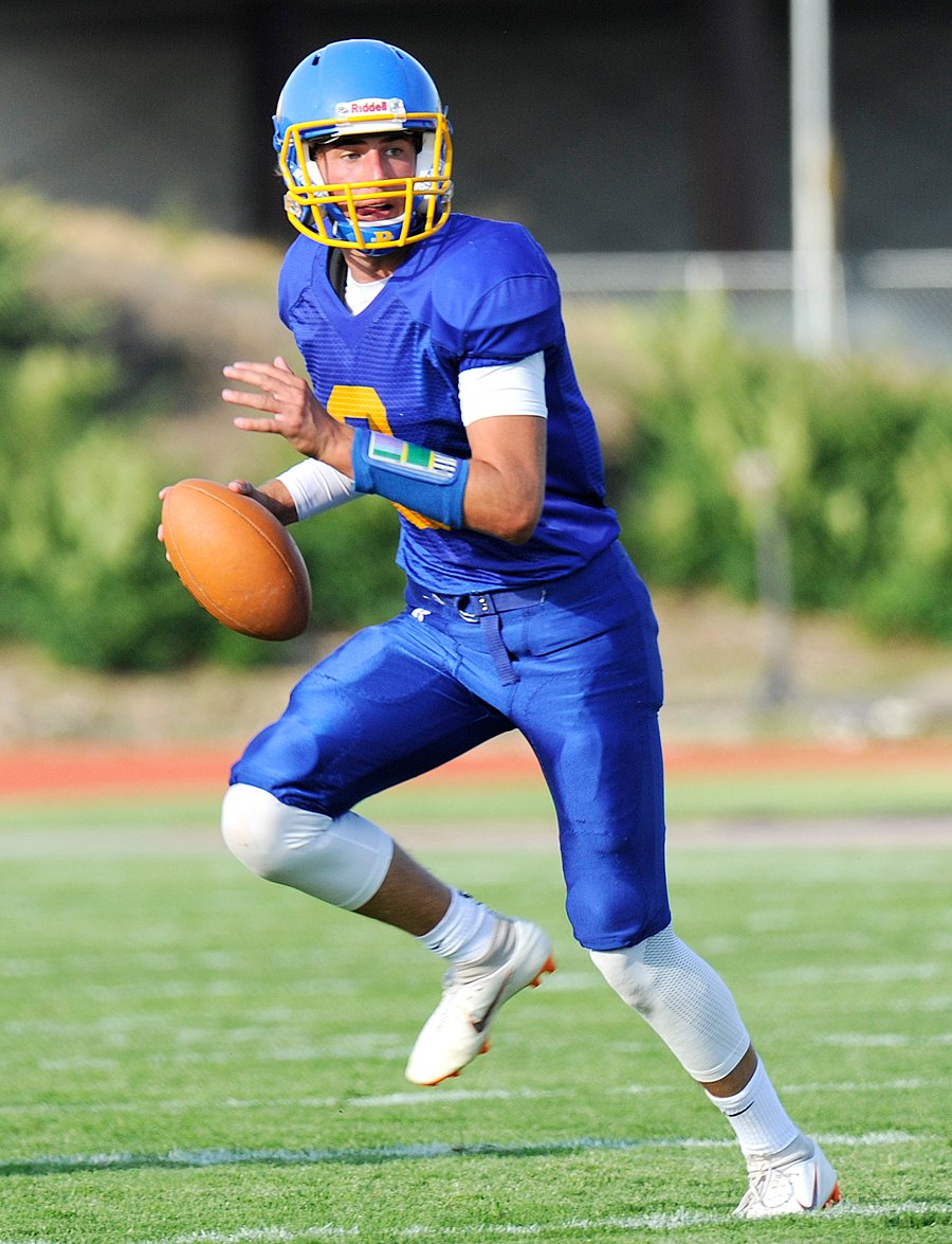 <who>Photo Credit: Lorne White/KelownaNow </who>QB Liam Attwood was good on four of 10 passes for 132 yards and two touchdowns. "He's matured and become a dynamic and dependable field general this year under the guidance of our offensive coordinaters Chance McCoy and Mike Wolthuisen," pointed out RSS head coach Pete McCall. "We designed a new playbook this year and Liam is really settling into it." 