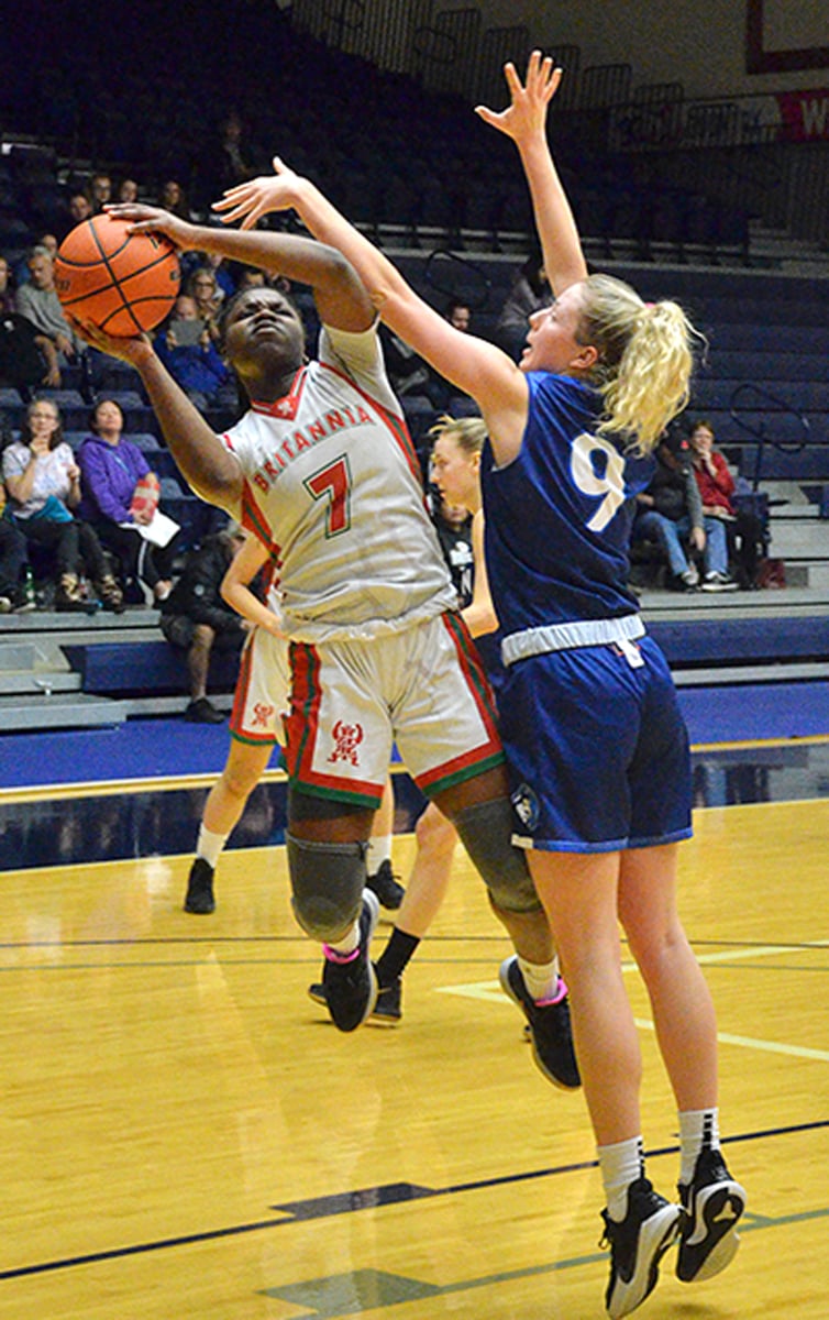 Lily Pink, right, of the OKM Huskies was selected as the Tsumura Invitational's most valuable player.