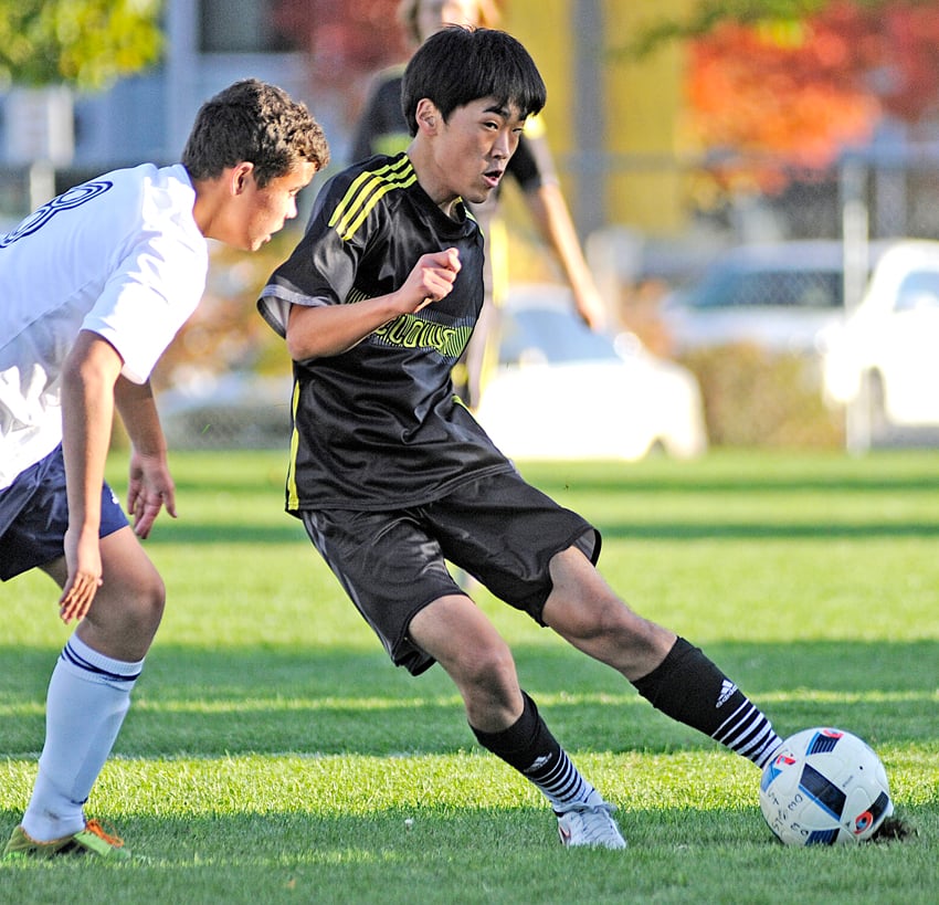 <who>Photo Credit: Lorne White/KelownaNow </who>Jay Park of the KSS Owls finds space to make a pass to a charging teammate in a scoreless second half.