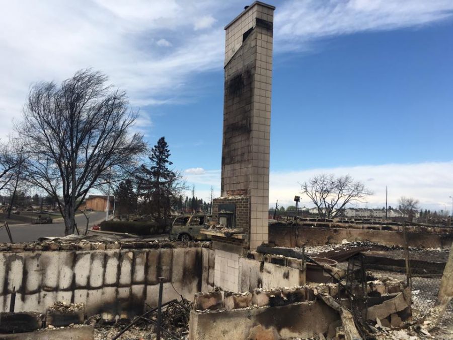 <who>Photo Credit: Robbie Picard on Facebook</who>Picard's house and neighbourhood was wiped out by the fires. His chimney was the only thing left standing and the pictures of it went viral.