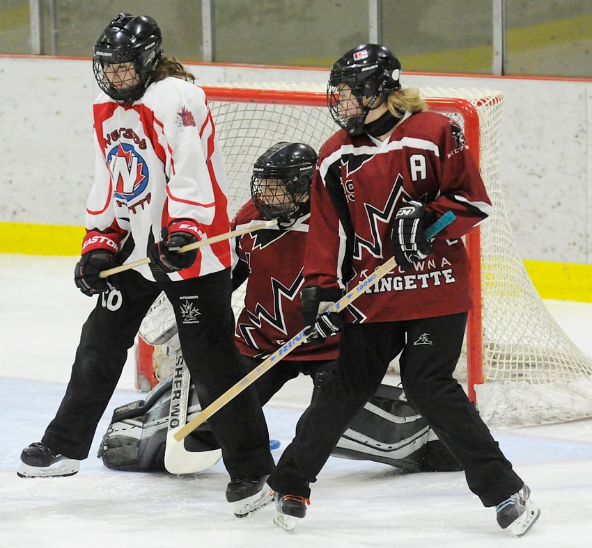 <who>Photo Credit: Lorne White/KelownaNow </who>Calry Ortinski, left, of the Westside Edge created a screen for teammate Victoria van Every as the latter took a free-ring shot that found the net behind the Kelowna Adrenaline goaltender Brian Fiset-Kinzel and defender Nyla Brown. It was the only goal in the U16B gold-medal game.