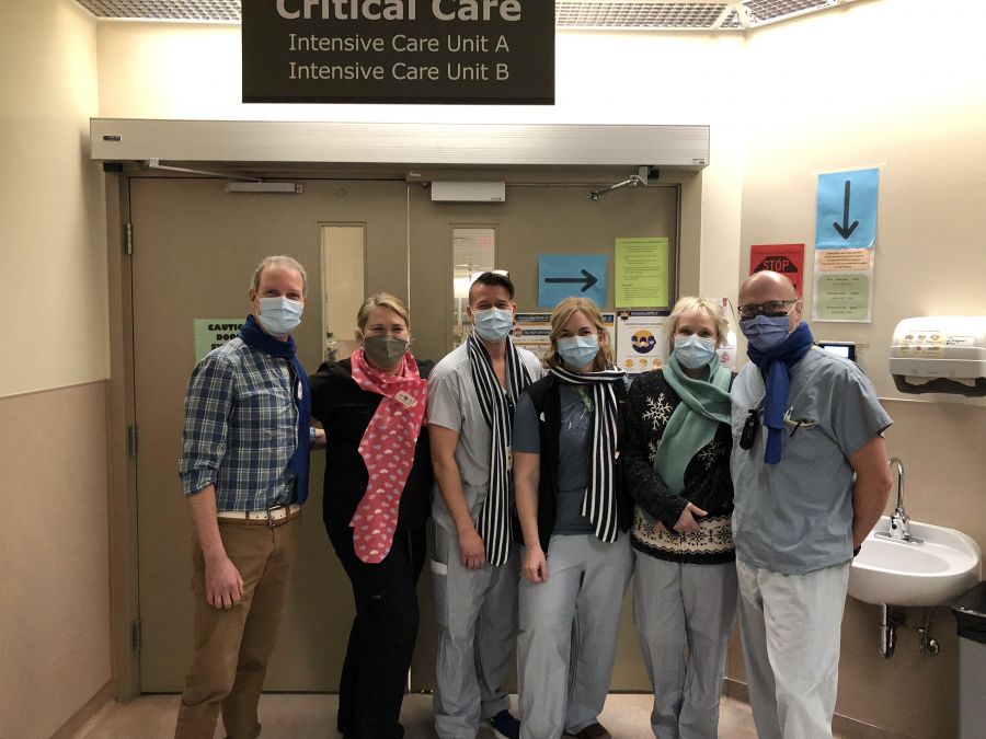 <who> Photo Credit: (Contributed)</who> ICU staff wearing hug scarves.