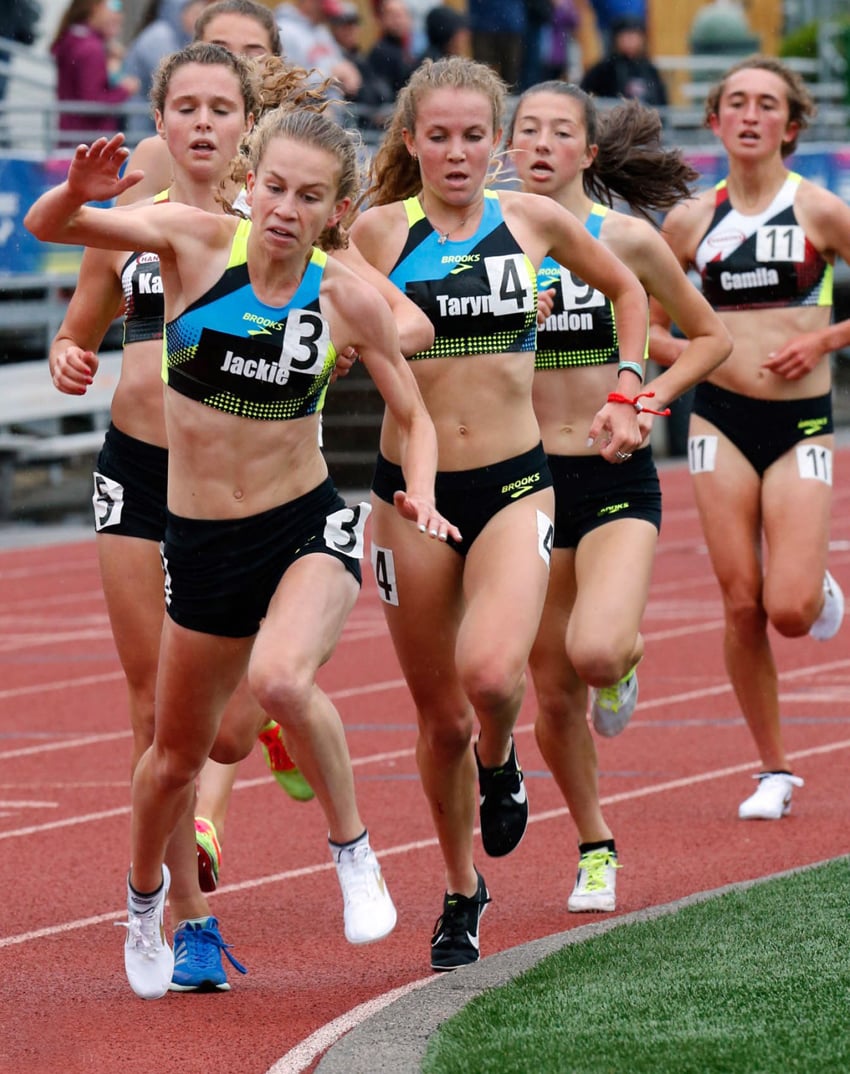 <who>Photo Credit: Margot Kelly/Photography LLC </who>Jacqueline Gaughan (3) stumbles late in the race, but O'Neill (4) stays on track.