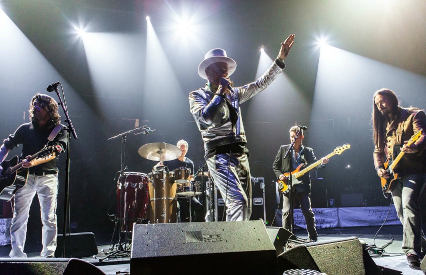 <who> Photo Credit: Mike Homer. </who> The Tragically Hip performing in Hamilton. 
