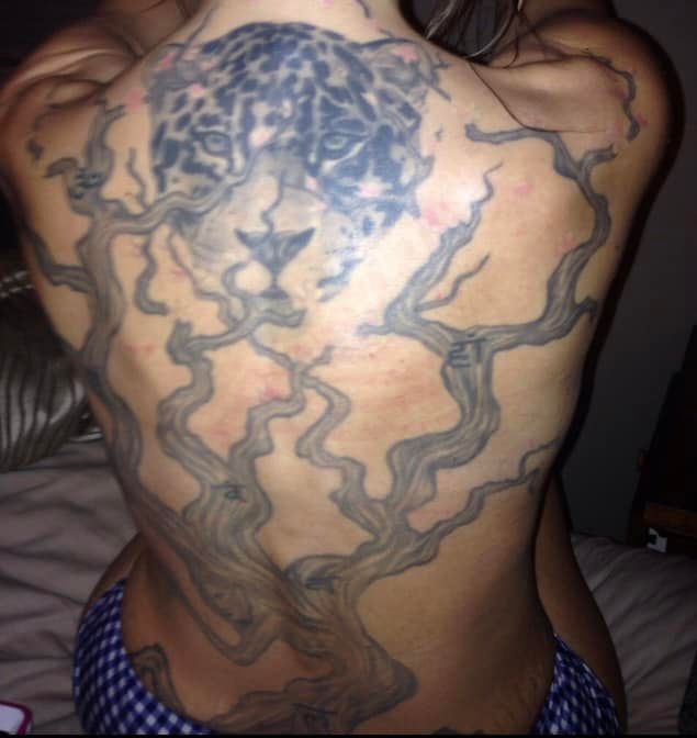 <who>Photo Credit: Facebook</who>Rejeana's daughter shared a photo of her back tattoo as well