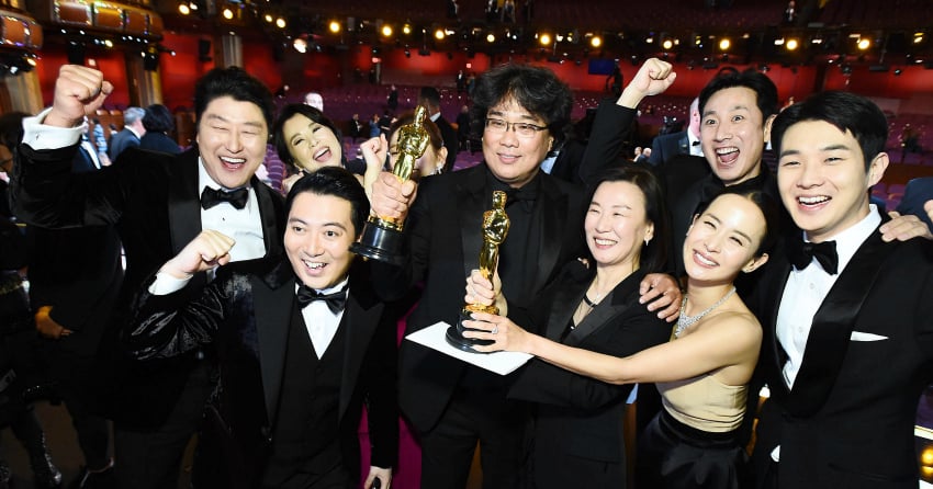The Parasite crew accepting their award.