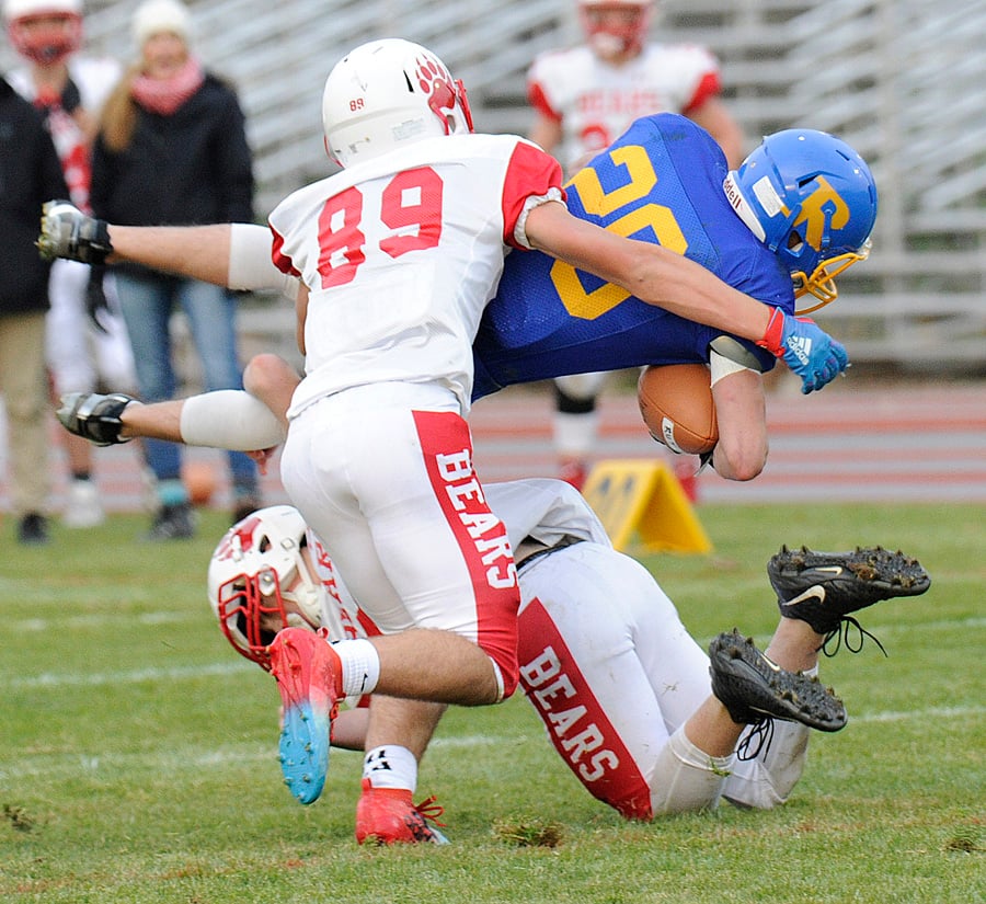The Bears' Nicholas Stansfield, a Pacific Conference all-star, and teammate Marshall Punch team up to bring down the Voodoos' Kyron Konkin.
