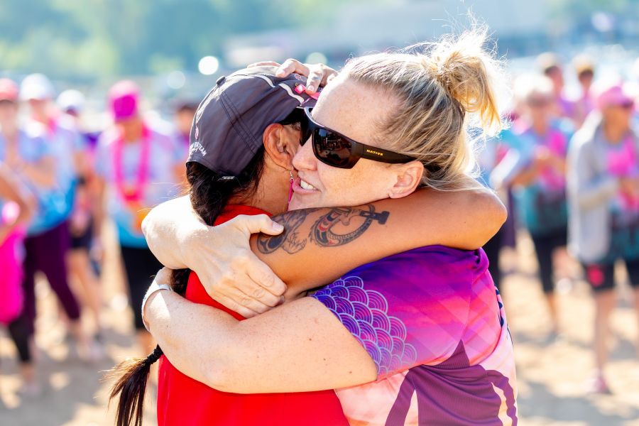 <who>Photo Credit: NowMedia/Gord Goble</who> Liz Vance gets a hug after leading mass warm-up