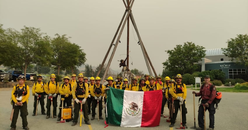 <who> Photo Credit: BCWS</who> The contingent of Mexican firefighters leaving the fire for their last break on Aug.7