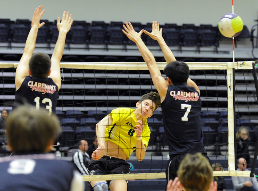 The Owls' Jayden Lalonde smashes for a point in semifinal play against Claremont.