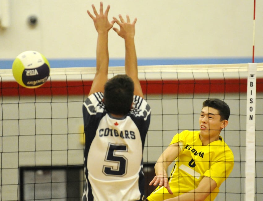 <who>Photo Credit: Lorne White/KelownaNow </who>The Owls' Jacob Obst spikes for a point against College Heights at Mt. Boucherie Secondary.