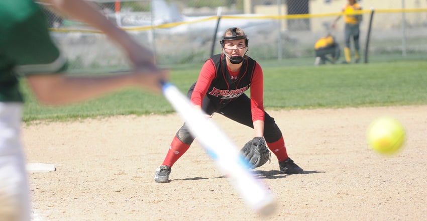 <who>Photo Credit: Lorne White/KelownaNow </who>Third baseman Haley Martin of the Kelowna Heat gets set to defend against the South Delta Invaders.