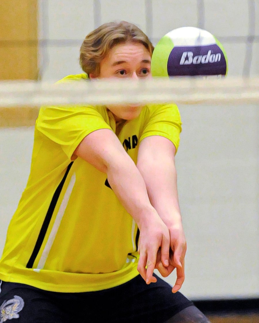 <who>Photo Credit: Lorne White/KelownaNow </who>The Owls' Mason Sodaro receives a serve against OKM in the Valley final.