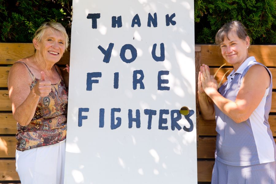 <who>Photo Credit: NowMedia</who> Wendy Nickel (left) and Lauren Cornish show their firefighter appreciation