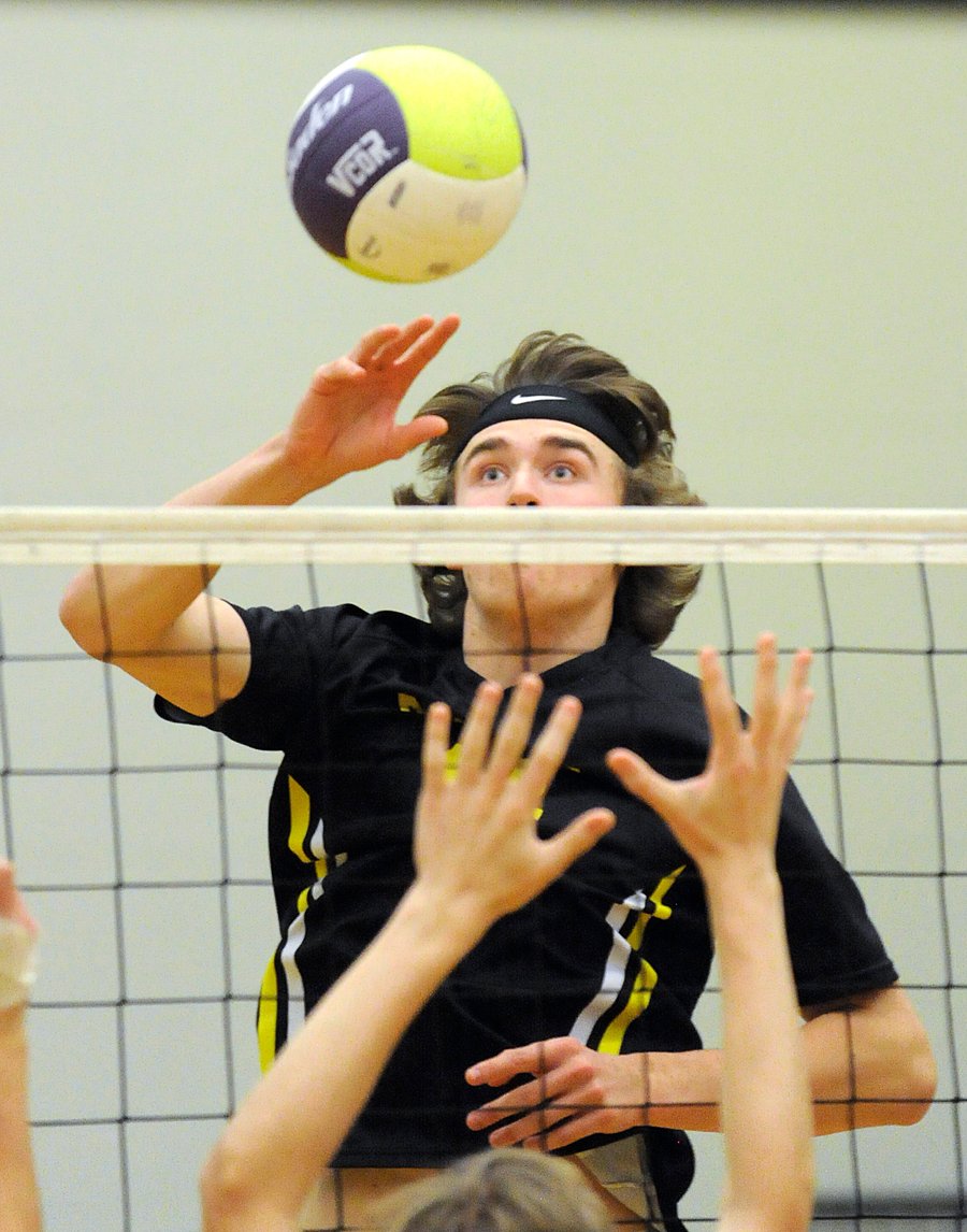 <who>Photo Credit: Lorne White/KelownaNow </who>Riley Brinnen of the Owls goes high to tip at the net.