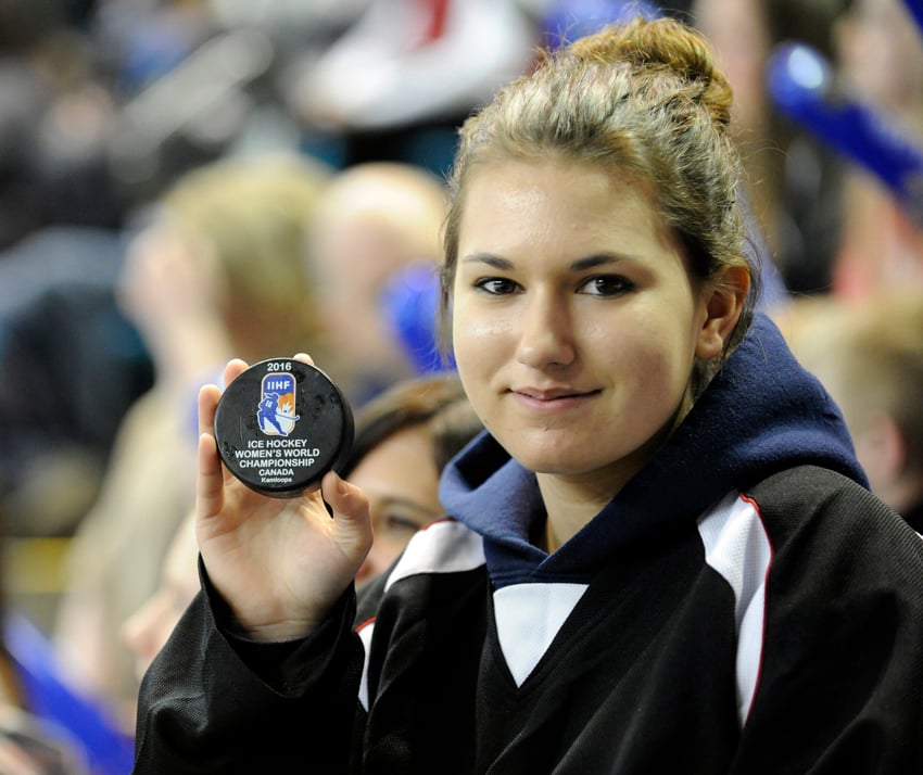 <who>Photo Credit: Lorne White/KelownaNow.com </who>A young fan shows off the IIHF world championship puck she retrieved in the first period on Monday at the Sandman Centre.