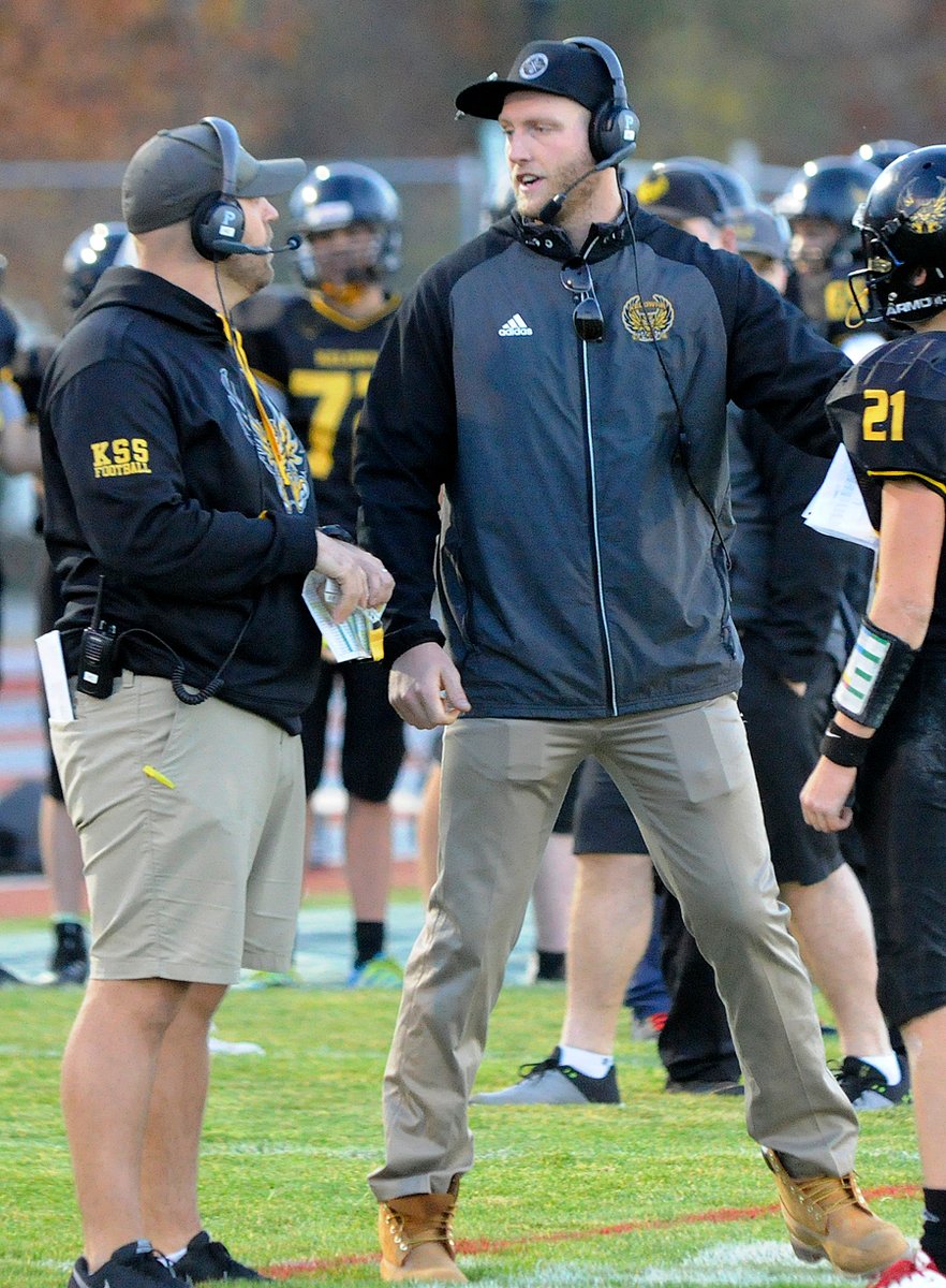 <who>Photo Credit: Lorne White/KelownaNow </who>KSS coaches Chris Cartwright, left, and Jerod Zaleski high on Ulm and the 2019 edition of the Owls.