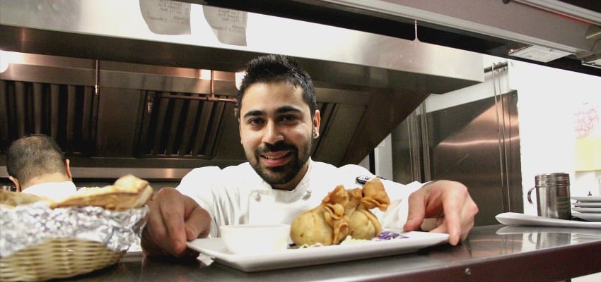 <who> Photo Credit: KelownaNow. </who> Govind Siwach was born in India and is now cooking up traditional food right here in downtown Kelowna. 
