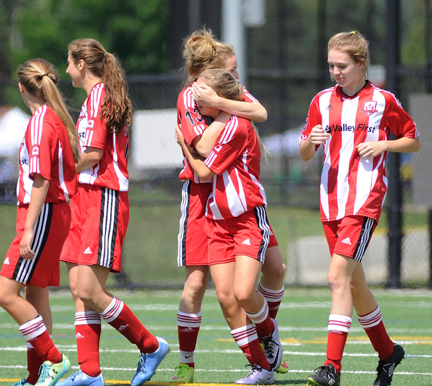 <who>Photo Credit: Lorne White/KelownaNow </who>Zayin Brown of the United U15s gets a hug from teammate Chelsea Cristofoli after scoring off a cross from Katrina Schrod (second from left). Others in on the celebration are Catherine Howe, left, and Gracie Matheson, right.