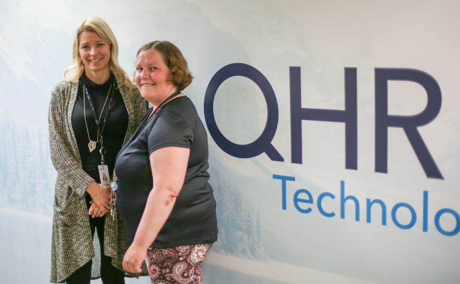 QHR office Manager Colleen, and Pathways employee Charity