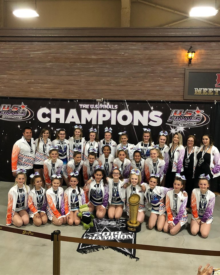 <who>Photo Credit: Contributed</who>The team and coaches in their champions ceremony with jackets, trophy and banner at US Finals at Southpoint Convention Center in Las Vegas.