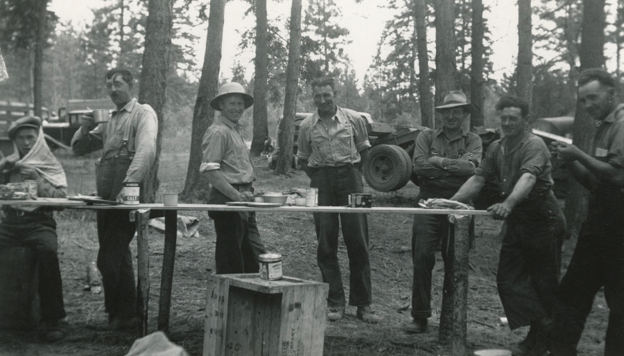 <who> Photo credit: Okanagan Special Collections OSC ARC 02 001 003b 059 </who> Man in helmet, third from left, is David Jeffrey, forester. Man third from right is Charlie Stuart, S.M. Simpson logging superintendent.