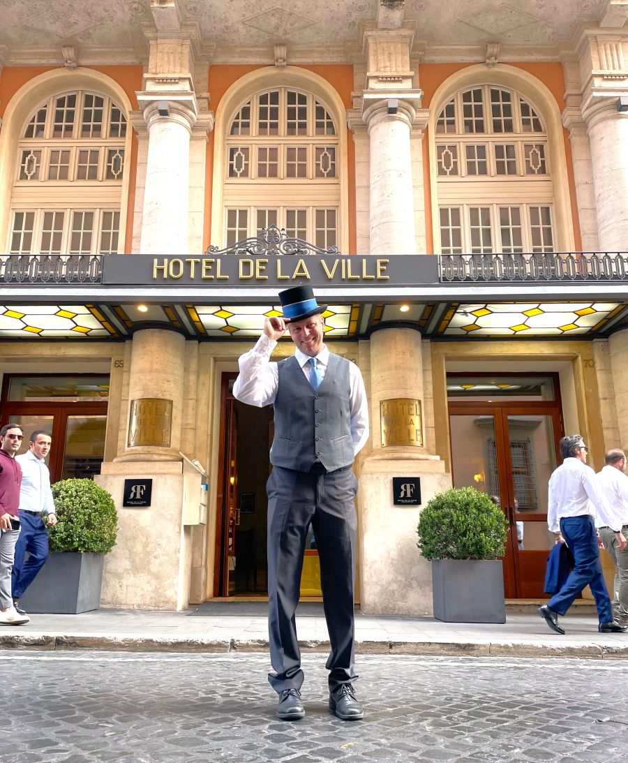 </who>Doorman Massimo greets us at the Hotel de la Ville, the best hotel in Rome.