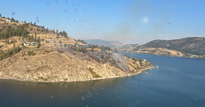 Firefighters bring Okanagan Lake wildfire under control with air tankers, helicopters