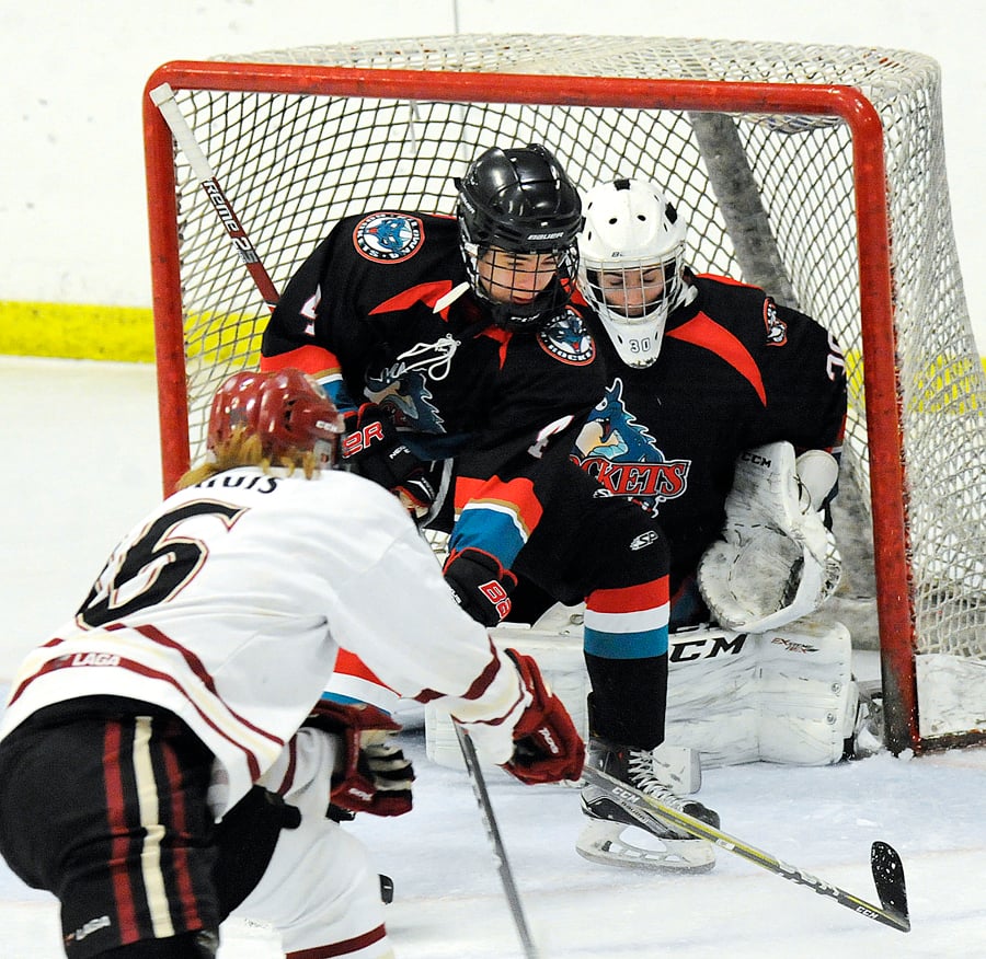 <who>Photo Credit: Lorne White/KelownaNow </who>Jesse Keller comes in defence of goaltender James Benjamin Peters in their win over Chilliwack.