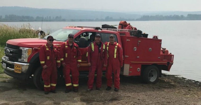 <who>Photo Credit: Contributed</who>Team of professional firefighters from Kelowna prepare to leave for Fraser Lake to help with wildfire response. 