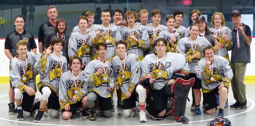 <who>Photo Credit: Lorne White/KelownaNow </who>The Kelowna Kodiaks won their third straight midget B lacrosse tournament on the weekend at the Rutland Arena. They defeated Kamloops in the final to claim the Andy Woods Memorial title. Members of the winning team are, from left, front: Justin Charlton, Colin MacGregor, Taryn Munson, Zander Torres, Colten Wasylenko, Shaun Agostinho and Jaeda Cox. Middle: Zane Torres (assistant coach), Mike Phillips (assistant coach), Blake Spragge, Tanner Warren, Nolan Katinic, Tyler Johnston, Dexx Belanger, Juia Diemand, Quinn Johnson-Plant (assistant coach). Back: Jamie MacGregor (assistant coach), Brendin Fritsen, Zachary McGill, Zeb Pink, Bradley Swecera, Chase Schiavon, Aiden Hogarth, Gregg Parrent (head coach).