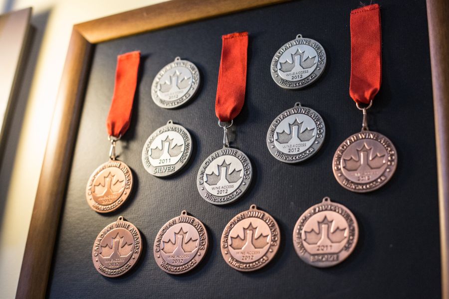 <who>Photo credit: KelownaNow</who> A small portion of the awards Gray Monk and the Heiss family have received 