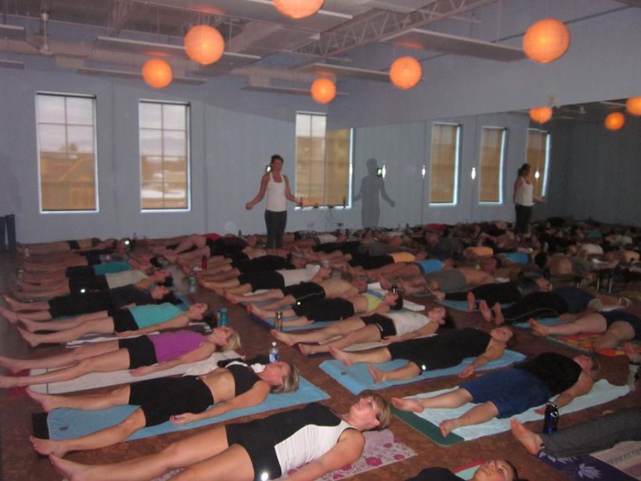 <who> Photo Credit: Contributed. </who> Sutton teaching her first class at Moksha Yoga. 