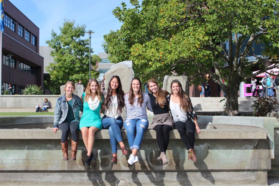 <who> Photo Credit: Global Gala website </who> UBCO nursing students are pictured at the courtyard on campus.