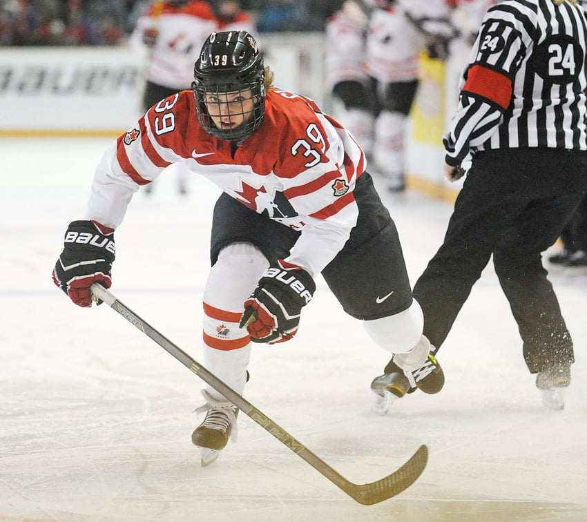 <who>Photo Credit: Lorne White/KelownaNow.com </who>Emily Clark of Canada speeds down he left wing on a forecheck against the U.S. in the first period