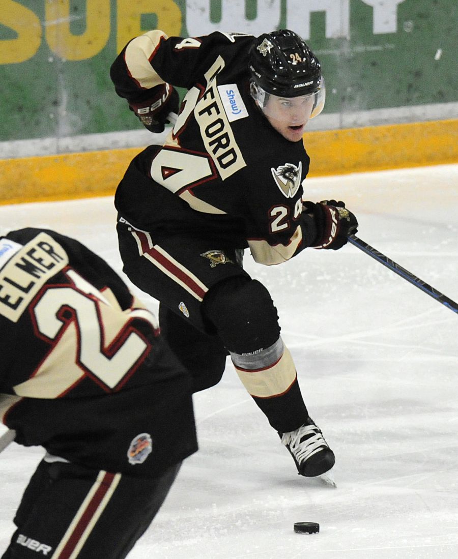Deegan Mofford of the Warriors about to pass the puck out of the West Kelowna zone.