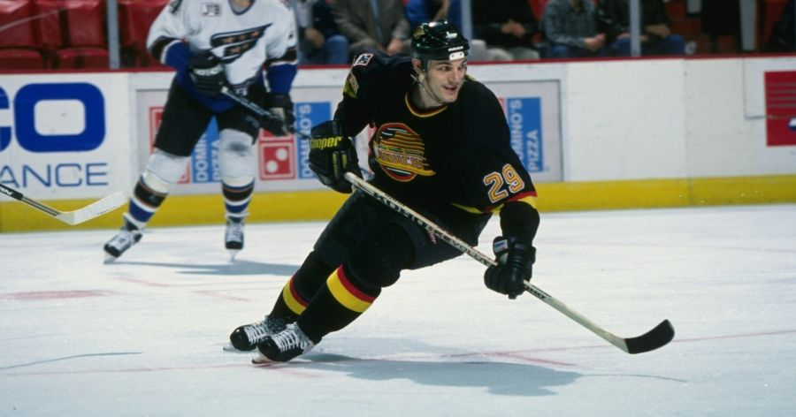 <who>Photo Credit: Getty Images</who>Odjick with the Canucks in March 1997.