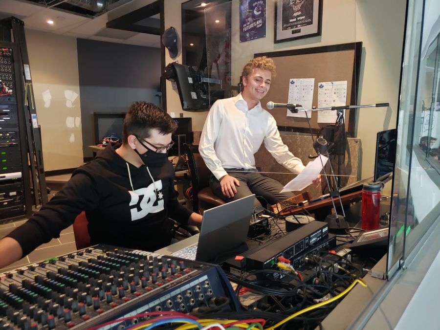 <who> NowMedia </who> Audio person Carson Lougheed, on left, and Vees announcer Joey Pitt.