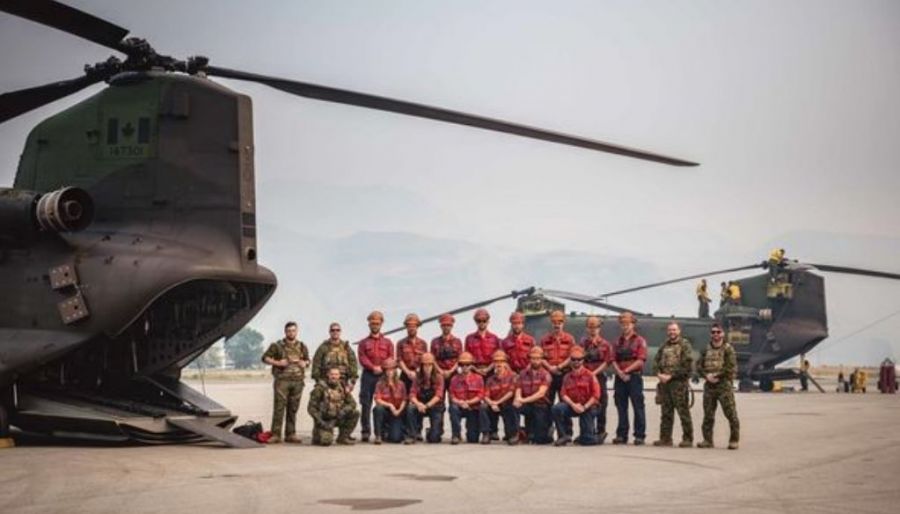 <who>Photo Credit: BCWS</who>The Flathead Unit Crew, whose home base is Cranbrook, with the Air Crew from the Canadian Armed Forces 450 Tactical Helicopter.