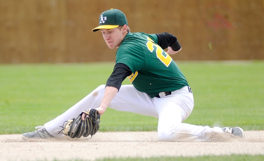 <who>Photo Credit: Lorne White/KelownaNow </who>Jackson Borne of the Okanagan A's snags a ground ball hit by a Victoria Eagles batter in Sunday's second game of a B.C. Premier Baseball League doubleheader at Elks Stadium.